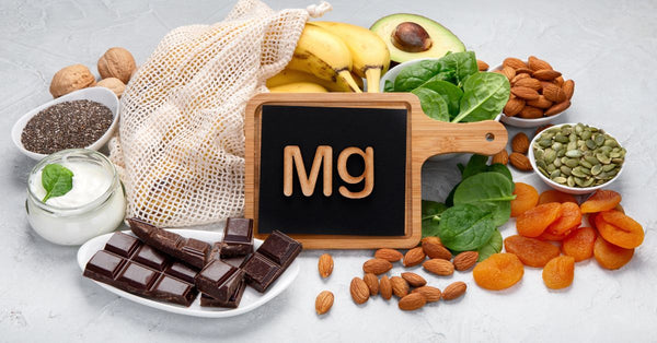 Healthy magnesium-rich foods including nuts, spinach, bananas, chocolate, and yogurt showing how does magnesium support well-being