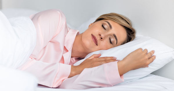 Woman over 45 sleeping peacefully, exploring natural sleep aids for women over 45 for restful nights
