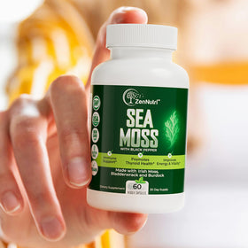 Load image into Gallery viewer, ZenNutri Sea Moss bottle in hand towards camera
